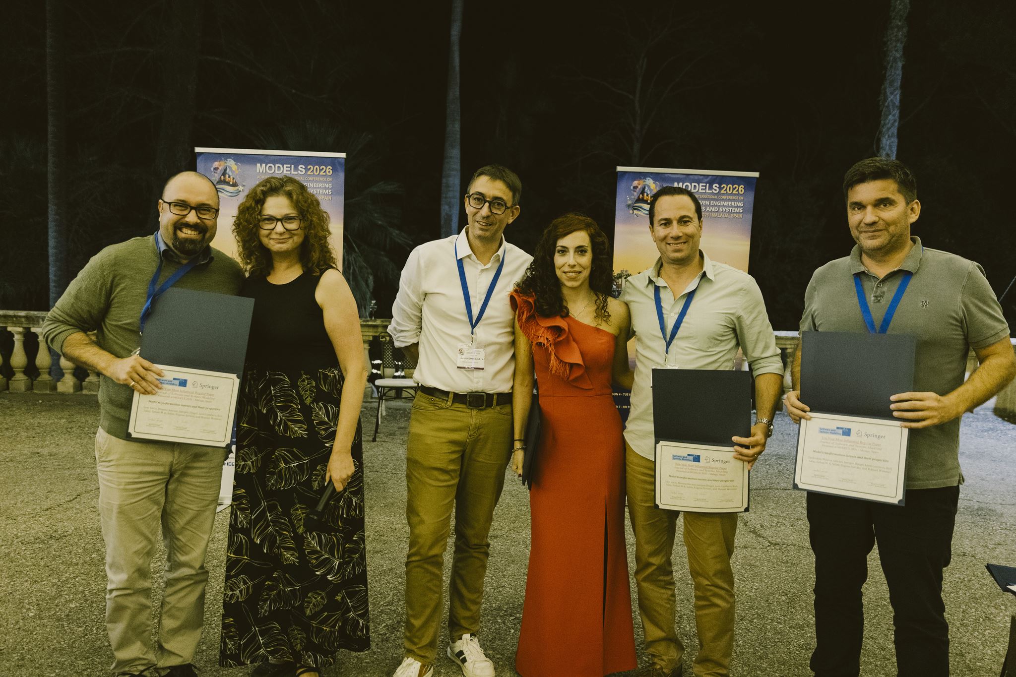 Eugene and co-authors receiving the SoSyM award